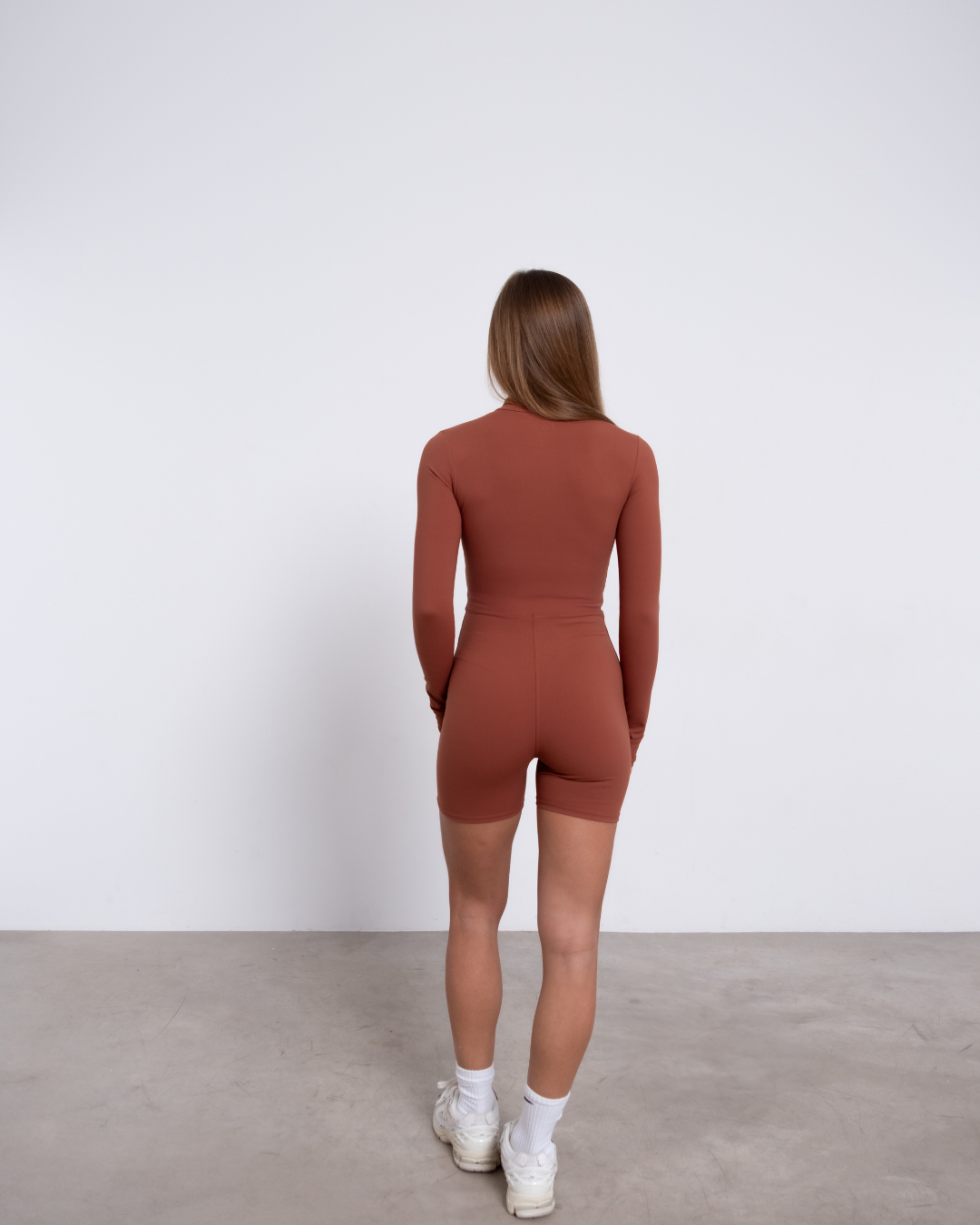 DAISY MONO DEPORTIVO DE MANGA LARGA EN TERRACOTA