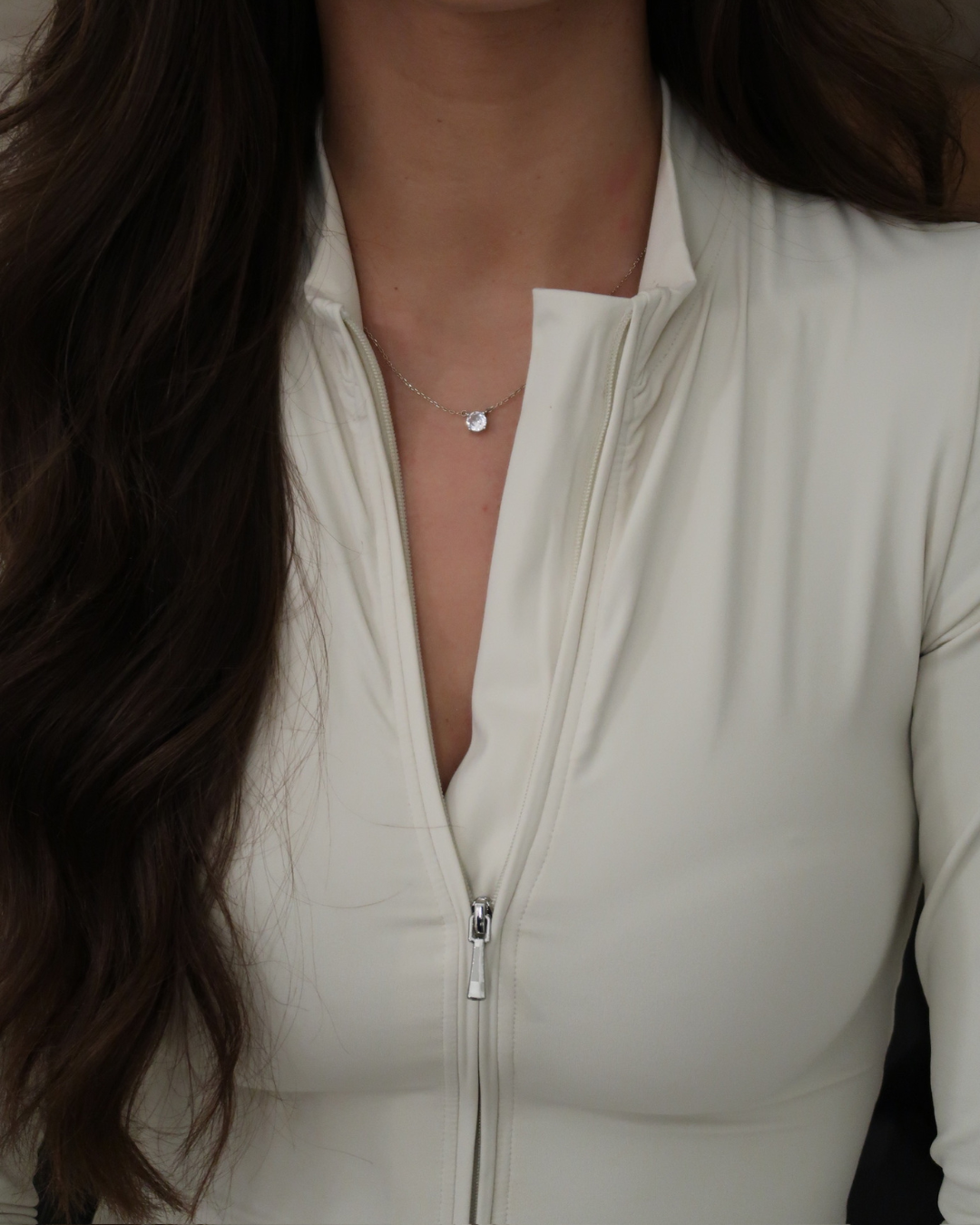 JADE MONO DEPORTIVO MANGA LARGA EN CREMA