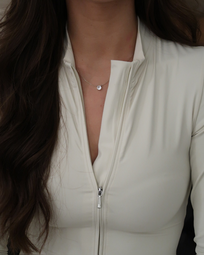 JADE MONO DEPORTIVO MANGA LARGA EN CREMA
